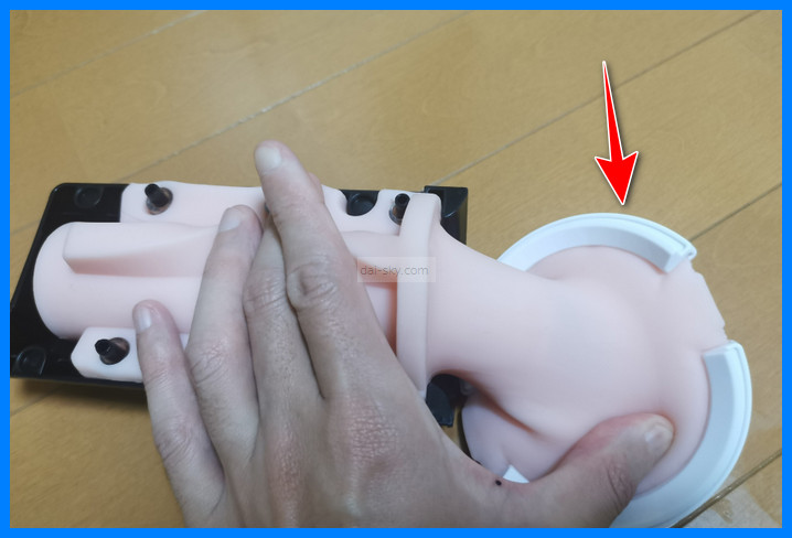 The white plastic ring on the official sleeve that stays locked in place