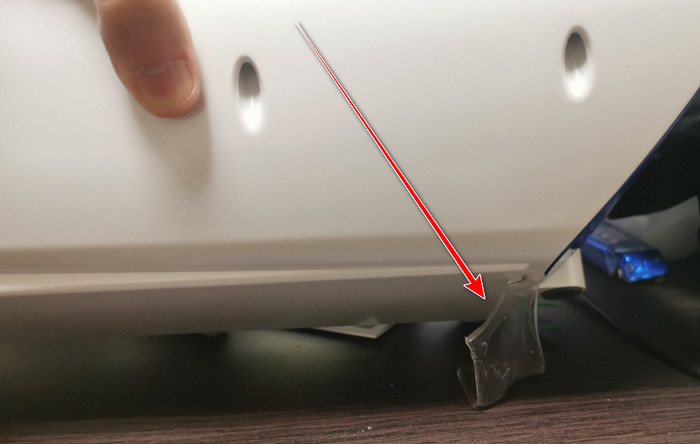 Double-sided tape under the A10 Piston SA holding it to the desk, with a red arrow