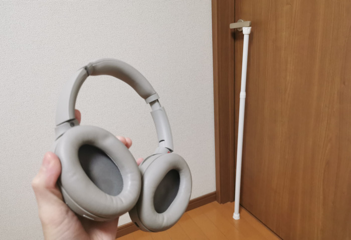 My noise-cancelling headphones, and a tension rod wedged under the door handle as a lock