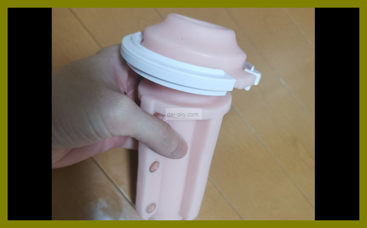 An A10 Piston SA dedicated sleeve held in one hand
