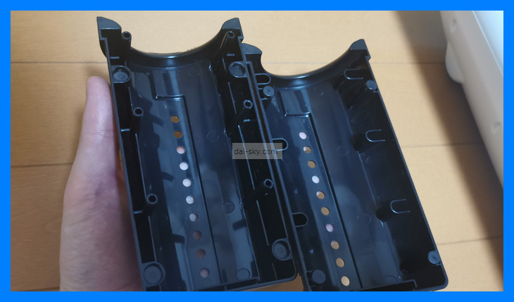 The black plastic inner case halves that hold the sleeve