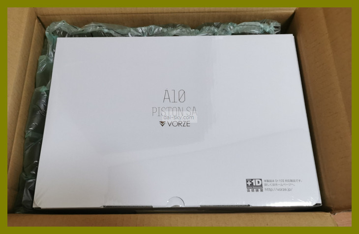 The white A10 Piston SA box inside the shipping carton