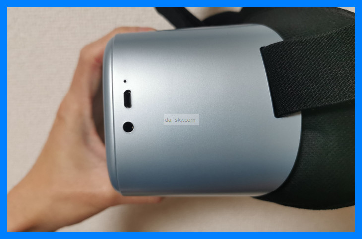 The micro-USB port and headphone jack on the side of the headset