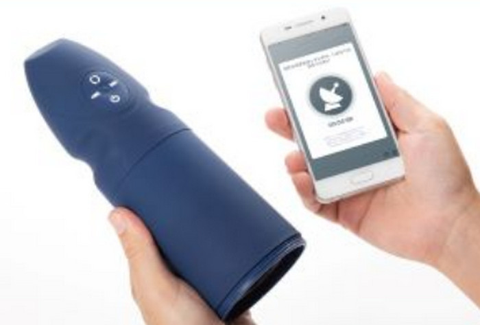 The Synchro Onahole held next to a smartphone running its app