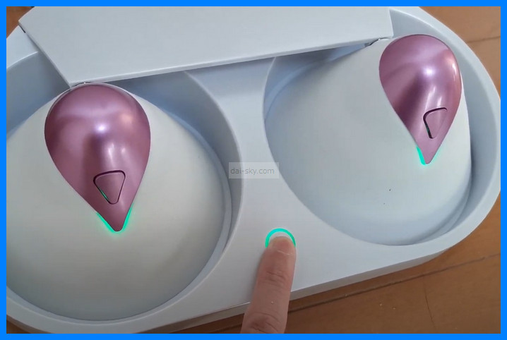 Pressing the cradle button, which glows green, to start warming