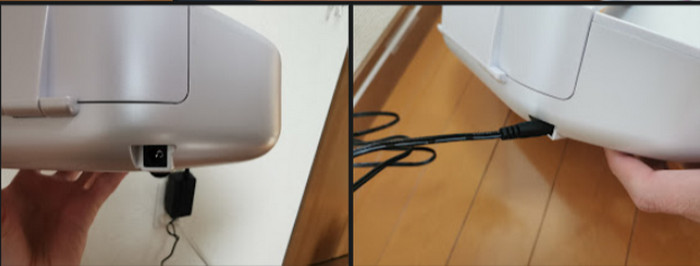 Plugging the charger into the back of the cradle