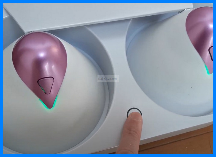 Pressing the button on the U.F.O. TW cradle to start warming